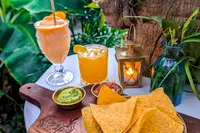 Vegan snacks and refreshing drinks served at The Coco Café in Aruba during a wellness stay at Boardwalk Boutique Hotel Aruba.