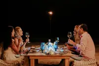 Full moon dinner experience at Atardi Adults-only beachfront dinner on Palm Beach in Aruba near Boardwalk Boutique Hotel Aruba, with dining options such as The Coco Café.