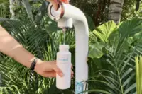 Reusable water bottle refill station at Boardwalk Boutique Hotel Aruba, supporting sustainable and responsible travel with our do good program.