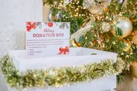 Holiday donation box at Boardwalk Boutique Hotel Aruba, supporting local community initiatives during the season of giving.