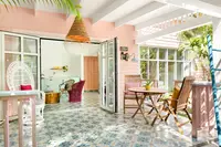 Plunge Pool Casita terrace at Boardwalk Boutique Hotel Aruba with shaded outdoor dining and open doors to the bright living area.