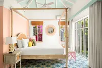 View from inside the private plunge pool overlooking the casita terrace and lush tropical garden at Boardwalk Boutique Hotel Aruba.