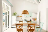 Two-Bedroom Casita dining area and kitchen at Boardwalk Boutique Hotel Aruba with open-plan layout