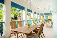Two-Bedroom Casita terrace at Boardwalk Boutique Hotel Aruba with outdoor dining and lounge area.