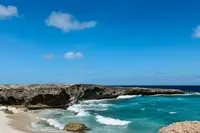 Rocky coastline near Palm Beach in Aruba, explored while staying at Boardwalk Boutique Hotel Aruba and visiting Arikok National Park.