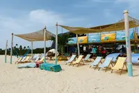 Windsurf event setup on Palm Beach in Aruba near Boardwalk Boutique Hotel Aruba, ready for sports and beach activities.