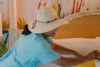 Linen Reuse program Housekeeping preparing a guest room at Boardwalk Boutique Hotel Aruba