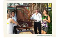 The two owners of Boardwalk Boutique Hotel Aruba welcoming guests during Bloggers Weekend 2014 in the tropical gardens.