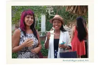 Guests enjoying Boardwalk Boutique Hotel Aruba Bloggers Weekend 2014 in the tropical garden setting.