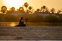 Sunset beach moment in Aruba, captured by Nathalie Clemens for the Boardwalk Boutique Hotel Aruba Artist in Residence story.
