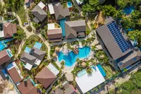 Tropical gardens at Boardwalk Boutique Hotel Aruba showcasing eco-friendly design and Green Globe Certification commitment.