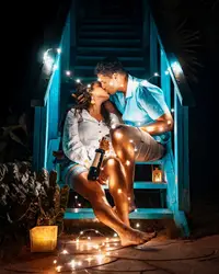 Couple with Christmas lights