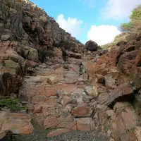 Stone pathway leading into caves in Arikok National Park Aruba, explored while staying at Boardwalk Boutique Hotel Aruba.