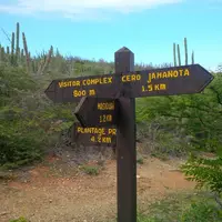 Visitor signage in Arikok National Park Aruba, guiding guests exploring nature from Boardwalk Boutique Hotel Aruba.