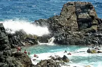 Natural pool along the coast near Palm Beach in Aruba, part of an Arikok National Park visit from Boardwalk Boutique Hotel Aruba.