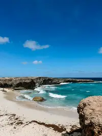 Rocky coastline near Palm Beach in Aruba, explored while staying at Boardwalk Boutique Hotel Aruba and visiting Arikok National Park.