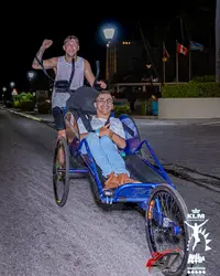 Marathon volunteering in Aruba with Luuk Loo, highlighting inclusion and community supported by Boardwalk Boutique Hotel Aruba.