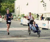 Community running event in Aruba with Luuk Loo, highlighting volunteering and inclusivity supported by Boardwalk Boutique Hotel Aruba.