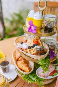 Breakfast stand with pastries and fresh fruit at The Coco Café at Boardwalk Boutique Hotel Aruba.