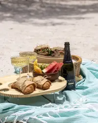 Beach picnic-to-go setup on the sand with snacks and drinks in Aruba
